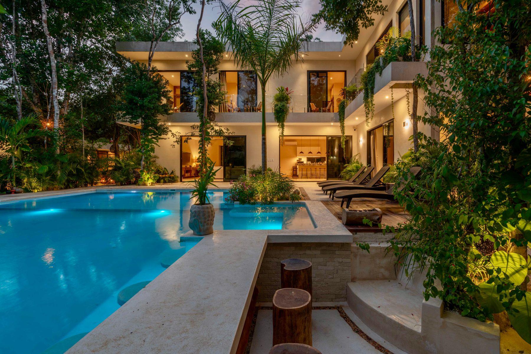 A contemporary tropical residence with landscaped grounds and a swimming pool